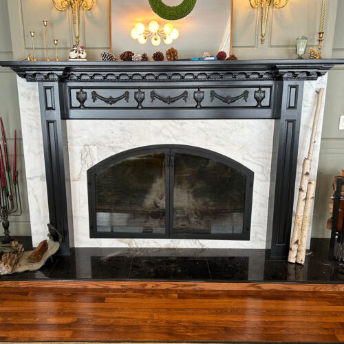 Installation of wood carvings on mantel